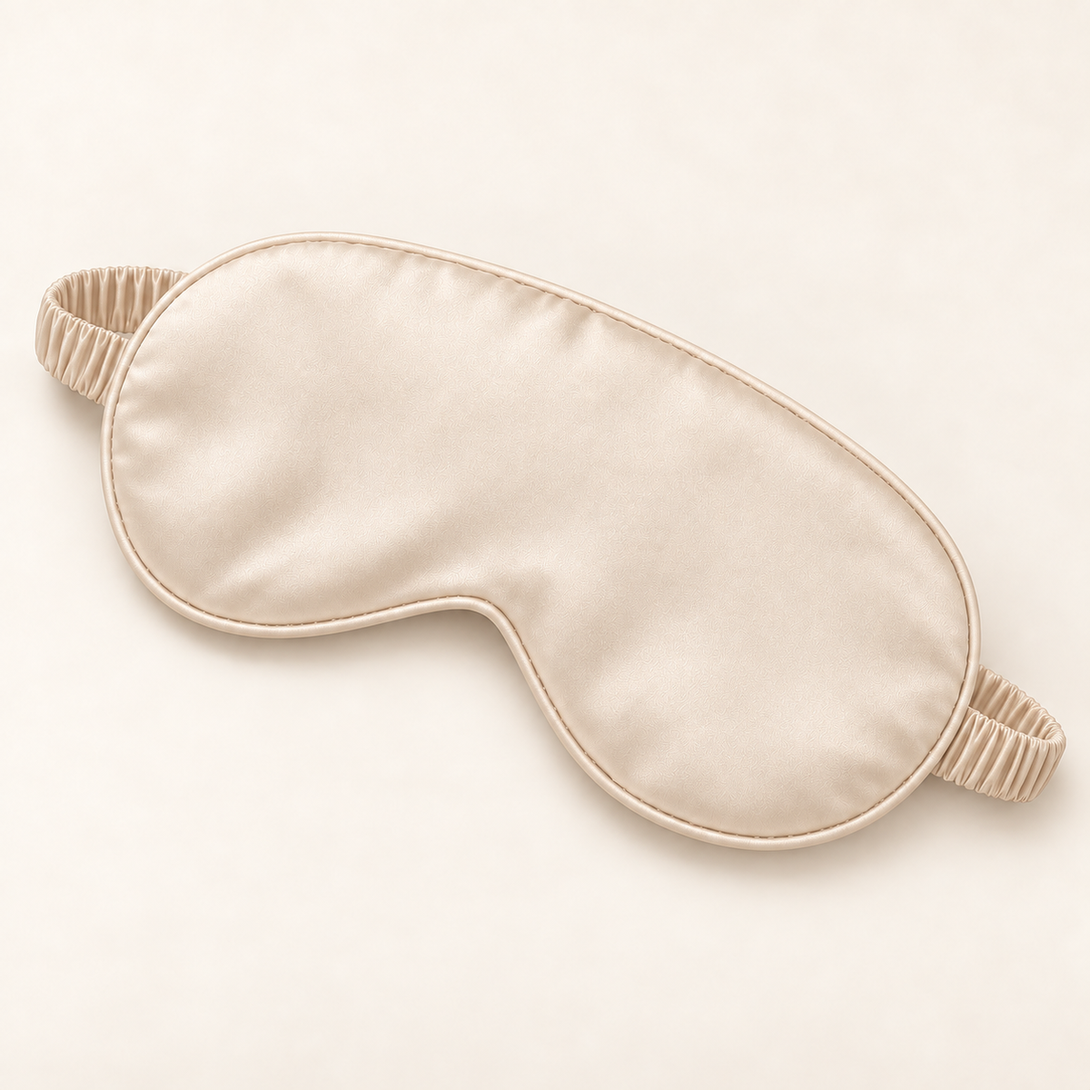 Hushly satin sleep mask in apricot on warm ivory