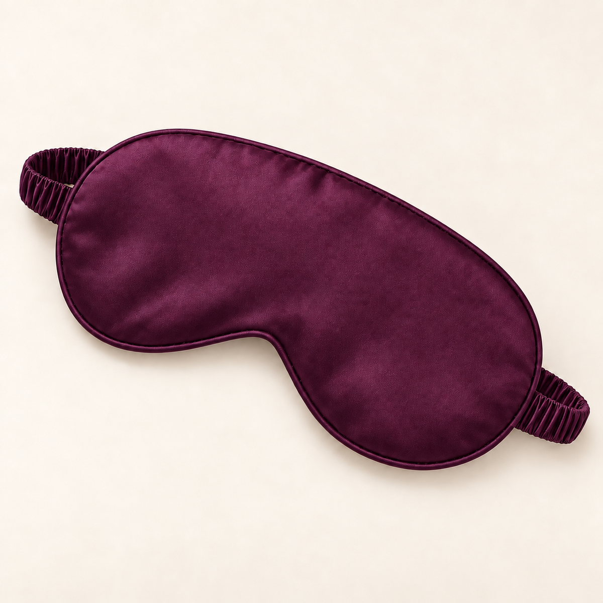 Hushly satin sleep mask in deep purple on warm ivory