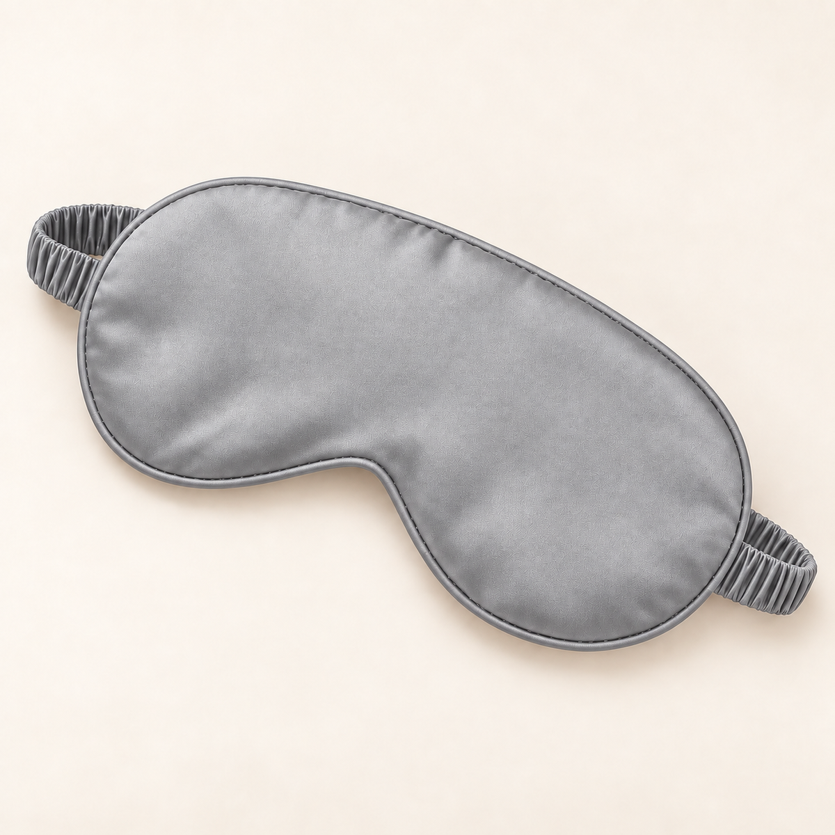 Hushly satin sleep mask in gray on warm ivory