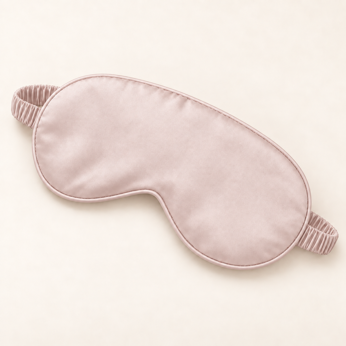 Hushly satin sleep mask in pink on warm ivory