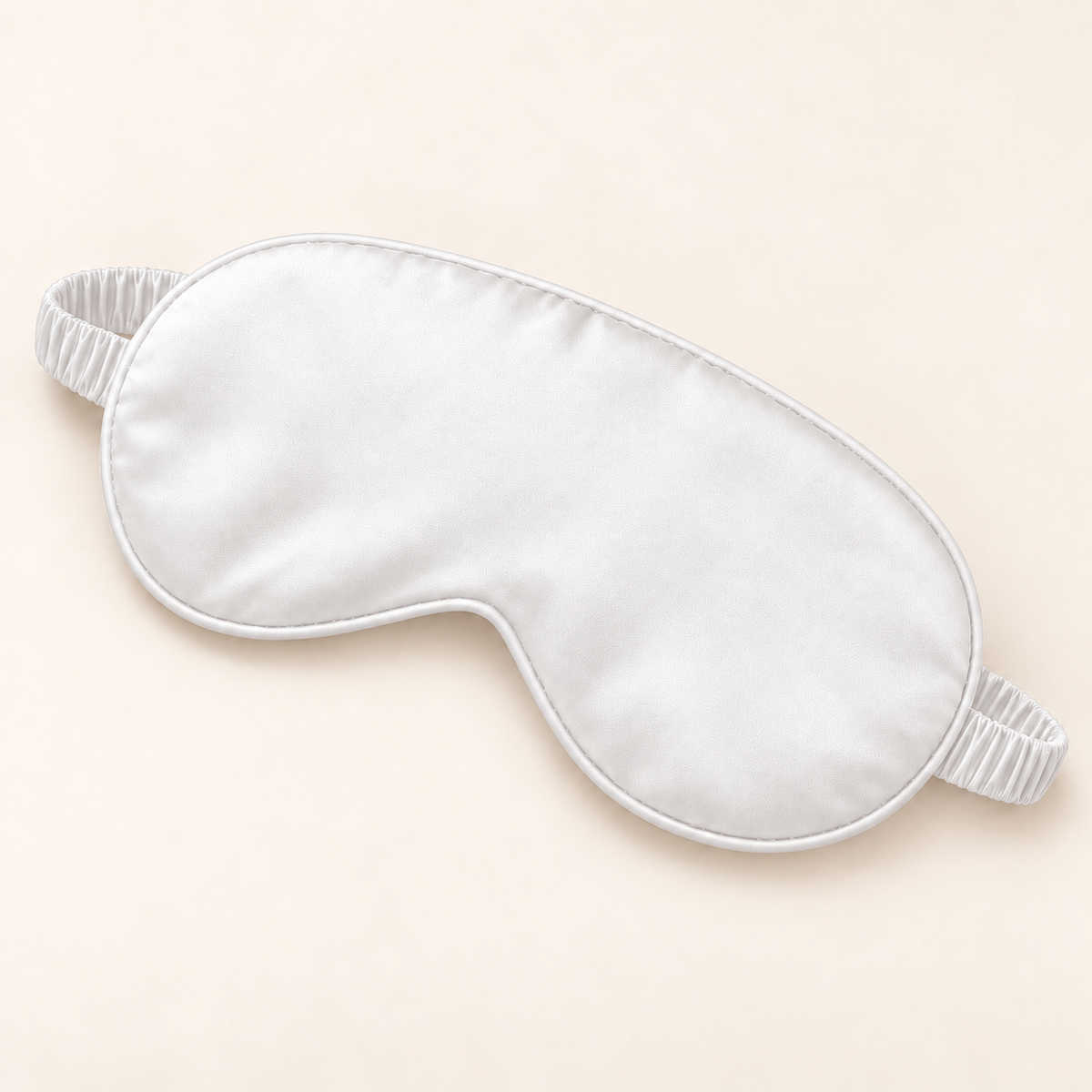 Hushly satin sleep mask in white on warm ivory